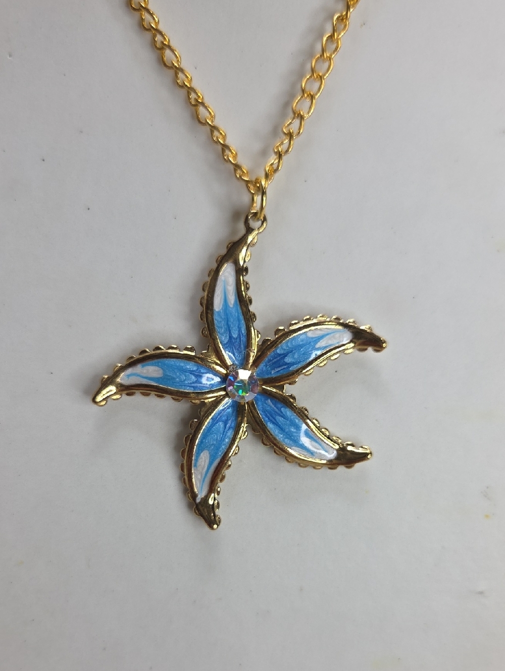 Gold-Tone Blue Enamel Starfish Pendant Necklace With AB Crystal Center